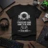 Black t-shirt with white text "I Paused My Game Game To Be Here To Be Here" and a video game