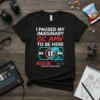 Black t-shirt with white and red text "I Paused My Imaginary OC AMV To Be Here", featuring a paused media