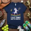 I Play Tennis And I'm Magical quote on a navy t-shirt featuring a unicorn playing tennis with a rainbow net