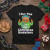I Put The IN Ugly Christmas Sweaters text with a cartoon orange monster wearing an ugly Christmas sweater, giving thumbs