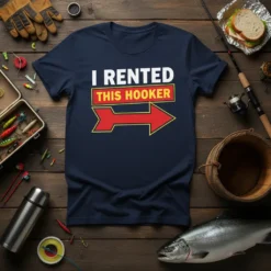 Navy t-shirt with "I Rented This Hooker" text and a red arrow graphic, featuring fishing gear background