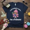 T-shirt design with text "I sell frosting for money... I'm a froistitute!" featuring a cartoon cupcake character holding money