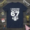 I Survived 100 Days of 67 T-Shirt featuring bold white text and a cartoon muscular man graphic