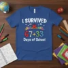 I SURVIVED 67+33 Days of School text with cartoon apple and school buildings on a blue t-shirt