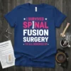 Blue t-shirt with white and pink text "I Survived Spinal Fusion Surgery I'm All Screwed Up" and a graphic of