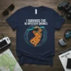 Navy blue t-shirt with white text "I SURVIVED THE NJ MYSTERY DRONES" above an orange outline of New Jersey filled