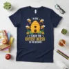 Teacher t-shirt with "I Teach The Cutest Beess In The Beehive" text, cute bees, beehive, sunflowers, and apples graphic