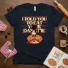 Black cat wearing an apron standing on a cherry pie with the text "I Told You To Eat Your Damn