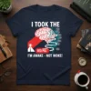 I TOOK THE RED PILL I'M AWAKE - NOT WOKE! text on a navy t-shirt, featuring a brain graphic and