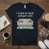 Navy t-shirt with white text "I tried so hard and got sofa" above a cartoon illustration of a white sofa