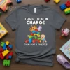 T-shirt with "I Used to Be in Charge Then I Had a Daughter" text and cartoon image of a baby