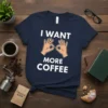 Navy blue t-shirt with white text "I WANT MORE COFFEE" and graphic of hands forming circles