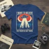 I Want to Believe The Truth Is Out There t-shirt featuring a retro UFO abduction design with vintage colors and