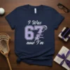 I Was 67 now I'm lacrosse birthday t-shirt design with purple numbers and lacrosse stick graphic