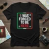 T-shirt design with text "I WAS FORCED TO BE HERE" in bold white and red font, framed by Italian flag