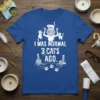 I Was Normal 3 Cats Ago quote on a blue t-shirt with a distressed woman surrounded by cats graphic