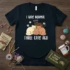 T-shirt with white text "I Was Normal Three Cats Ago" above a graphic of three stacked cats
