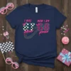 I WAS NOW I AM 67 68 birthday t-shirt with checkered and leopard print numbers, pink ribbon, and tire track