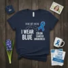 Navy t-shirt with white text "I Wear Blue Colon Cancer Awareness" and a blue ribbon symbol