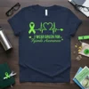 Navy t-shirt with green text and graphics stating "I WEAR GREEN FOR Fgimds Awareness," featuring a ribbon and heartbeat pulse