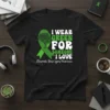 I Wear Green For Someone I Love T-Shirt with green ribbon and brain graphic for Traumatic Brain Injury Awareness