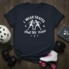 Graphic t-shirt with white text "I WEAR SKATES And Hit People" and two roller skaters colliding, on a navy blue