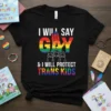 T-shirt with "I Will Say Gay And I Will Protect Trans Kids" text, rainbow hand graphic, and silhouettes of three