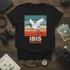Retro sunset graphic t-shirt featuring a white ibis bird with the text IBIS WILDLIFE below