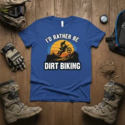 I'd Rather Be Dirt Biking t-shirt design featuring a dirt bike rider jumping over mountains against a sunset graphic