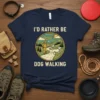 I'd Rather Be Dog Walking t-shirt with a graphic of a person walking a dog on a scenic trail