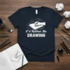 I'd Rather Be DRAWING T-Shirt featuring a hand sketching in a notebook, artist graphic