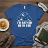 I'd Rather Be In Bed quote on a blue t-shirt, featuring a moon and stars cloud graphic with hands holding