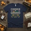 I'd Rather Be In Sacramento text design with bridge and state capitol graphic on a navy blue t-shirt