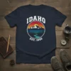 Idaho Est 1890 retro graphic t-shirt with mountain, river, and sunset landscape design