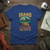 Idaho Is Calling And I Must Go t-shirt with a camping graphic of a tent, lake, and mountains