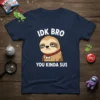 Navy t-shirt with "IDK BRO YOU KINDA SUS" text and a grumpy sloth graphic, referencing Among Us