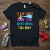Black t-shirt with colorful text "IF SHE DON'T HAWK TUAH IDON'T WANNA TALK TUHA" and cartoon woman spitting water