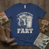Humorous t-shirt with text 'If They Talk Behind Your Back Fart' featuring a cool skunk character and an outhouse graphic