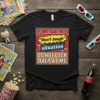T-shirt with bold red, yellow, and blue text that reads "IF WE ARE IN A 'Don't laugh' situation DO NOT
