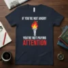 If You're Not Angry You're Not Paying Attention quote t-shirt with a flaming torch graphic