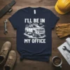 Navy t-shirt with white text "I'll Be In My Office" above a white graphic of an off-road pickup truck with