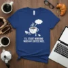 I'LL START WORKING WHEN MY COFFEE DOES quote on a blue t-shirt with a graphic of a tired coffee cup