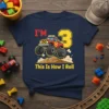I'm 3 This Is How I Roll text with a red monster truck graphic on a navy t-shirt, ideal for