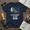 I'm Allergic To The Sun quote with silhouette of person holding umbrella under moon and stars on navy t-shirt