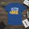 Blue t-shirt with white text "I'M DOING THIS FOR ME" and yellow graphic of a flexed bicep. Motivational gym wear