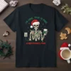 Skeleton wearing Santa hat tangled in Christmas lights, holding coffee, with text "I'm Fine This Is Fine Everything's Fine" on