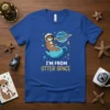 Astronaut otter sitting in a teapot with text "I'm From Otter Space" on a blue t-shirt