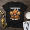 Black t-shirt with text "I'M INTO FITNESS FIT'NESS WHOLE TURKEY IN MY MOUTH" featuring a cartoon turkey in a mouth