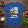 White text "I'm Just Here For Curry And Roti" above cartoon bowl of curry and stack of roti on blue