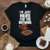 I'm Just Here For The Brownie text with cute animated brownie characters holding a spatula and a pan of brownies